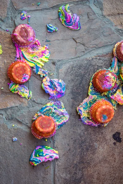 Fresh sweet multi-colored cakes have fallen to a floor, crash of festive pastries.