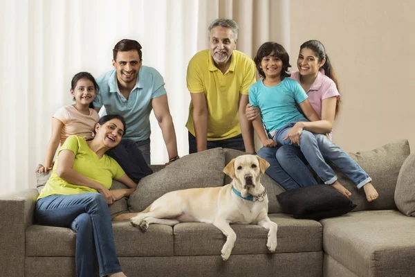 family in living room with their pet