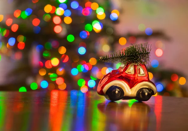 Miniature Red Car Ornament Carrying Christmas Tree Wooden Table Colorful — Stock Photo, Image