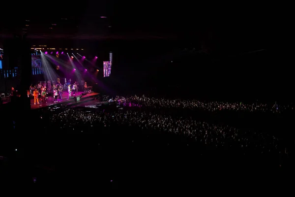 A musical concert of the group with color music, a crowd of spec — Stock Photo, Image