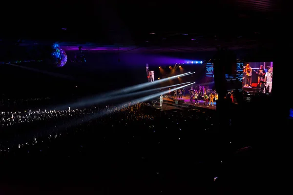 A musical concert of the group with color music, a crowd of spec — Stock Photo, Image