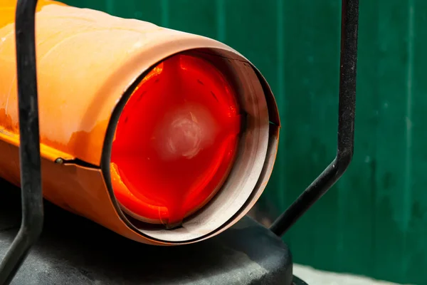 Orange heat gun for industrial heating of indoor air, fueled by Stock Image