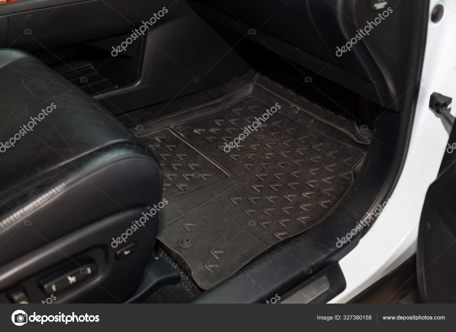 Dirty Car Floor Mats Of Black Rubber Under Passenger Seat In The