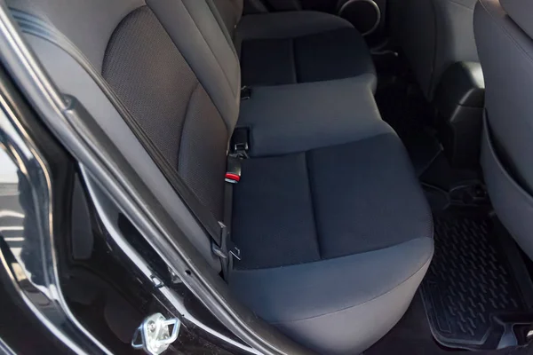 Close-up on rear seats with velours fabric upholstery in the int — Stock Photo, Image