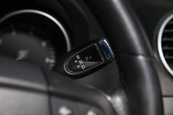 Automatic gear knob under steering wheel in black for driving an — Stock Photo, Image