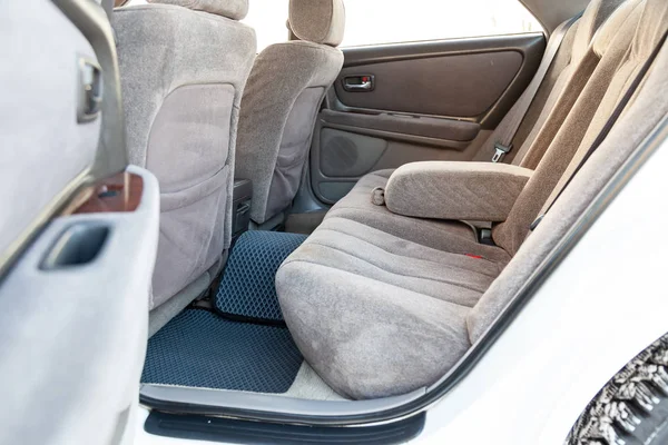 Close-up on rear seats with velours fabric upholstery in the int — Stock Photo, Image