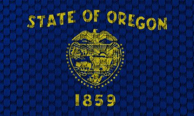 Oregon 'un ulusal bayrağı, bağımsızlık gününde farklı mavi ve sarı renklerde dikişli gri bir tekstil kumaşına karşı. Kıyafet ve endüstri.