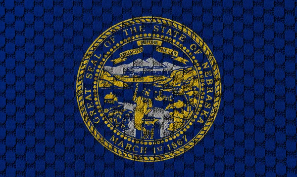 Národní Vlajka Usa Stát Nebraska Proti Šedému Textilnímu Materiálu Šicí — Stock fotografie