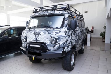 Novosibirsk, Russia - 02.26.2020: Gray used UAZ car with front view painted in gray raptor line-x paintprepared for off road drive