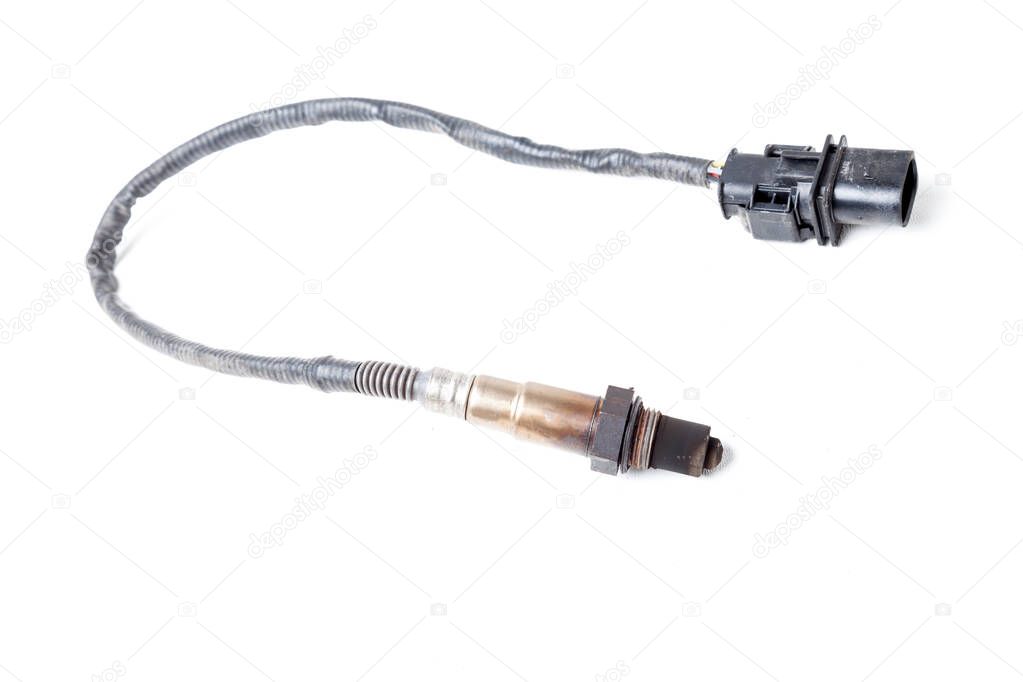 Lambda probe - oxygen sensor device designed to record tamount of remaining oxygen in the exhaust gas of car engine is located in exhaust system. Metal spare part for replacement to repair in workshop