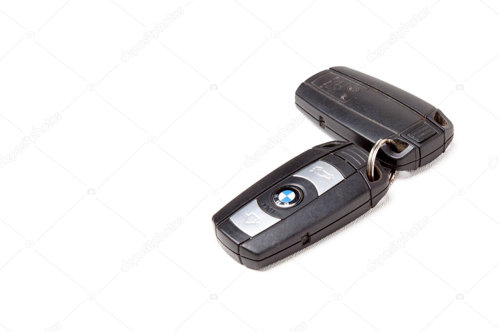 Novosibirsk, Russia - 05.05.2020: Key BMW brand keychain with chip - central locking control panel with dynamic code isolated on a white background in a photo studio. 