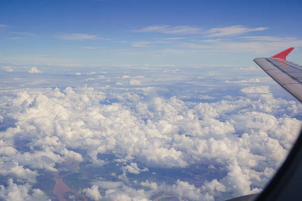 Beautiful Cloud Clouds of Vertical Development, Stratocumulus, Cumulus sky on the top view, airplane flying view from inside window aircraft of Traveling.