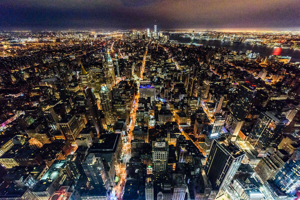 Aerial nightview of the buildings and skyscrapers of Manhattan illuminated
