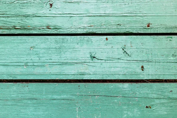 Doğal desenli eski yeşil ahşap doku.