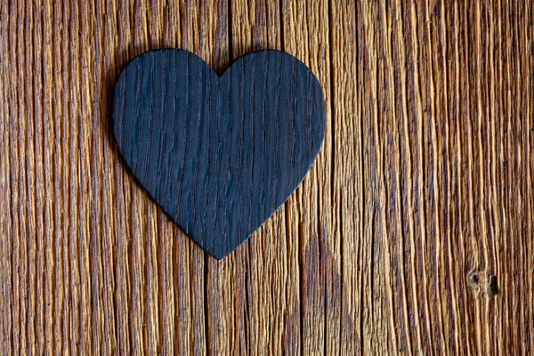 Wooden heart on old wooden background — Stock Photo, Image