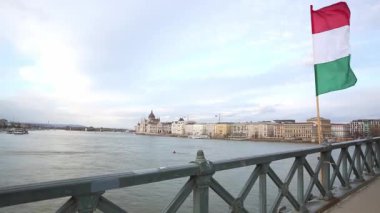 View of Danube River and Hungary flag from the Chain Bridge in Budapest