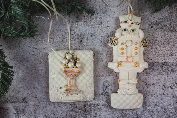 Hand painted Christmas gingerbread nutcracker on a beautiful grey background. Card concept. Top view. Flat lay. Copy space. — Stock Photo, Image