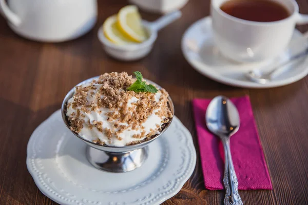 Chestnut puree with whipped cream and chocolate chips for dessert, restaurant menu