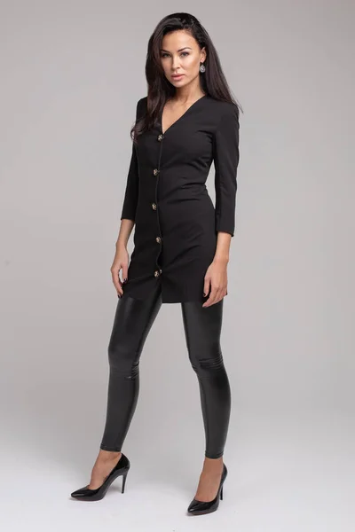 Stunning slim model in bright black dress and black heels. — Stock Photo, Image