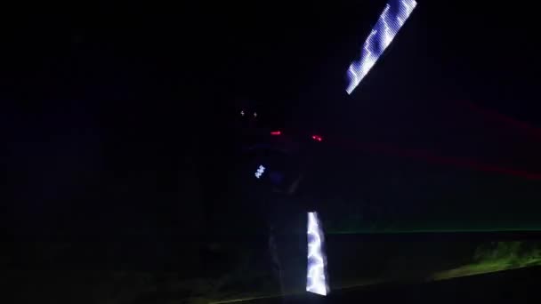 Unrecognizable person dancing with lights. — Stock Video