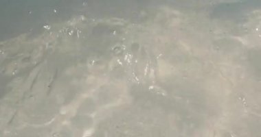 Wavy water in outdoors pool.