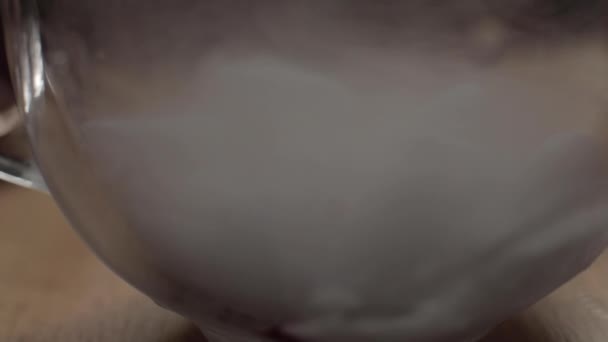 Close up realistic dry ice at glass bowl covered by dense smoke 4k footage — Stockvideo