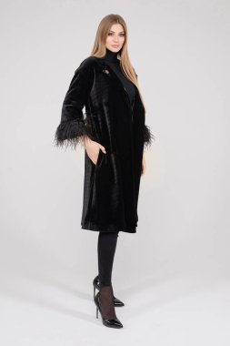 Attractive pretty lady in stylish clothes posing in studio