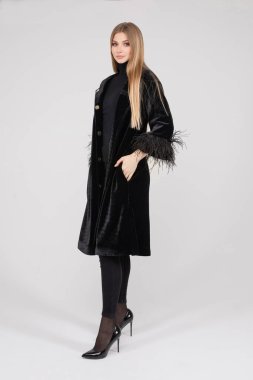 Attractive pretty lady in stylish clothes posing in studio