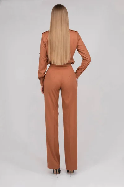 Slim model with long hair in coral jumpsuit. — Φωτογραφία Αρχείου