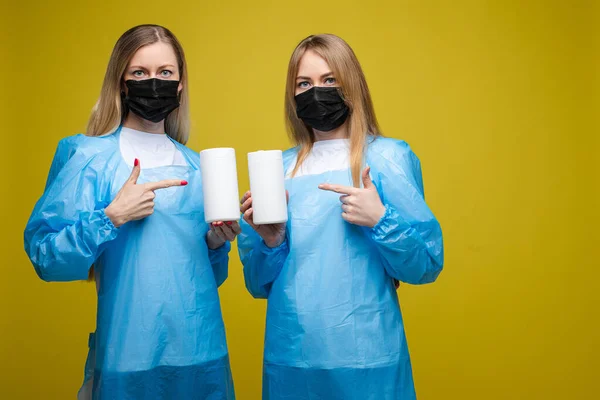 Two medical workers with sanitizers. Stop viruses concept.