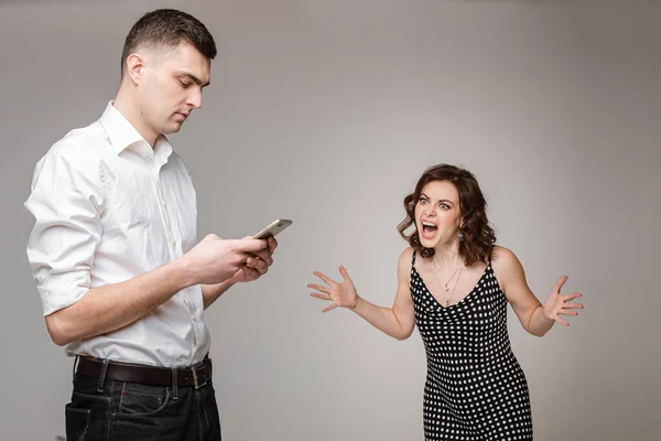 Young couple having a problem with phubbing. — Stock Photo, Image