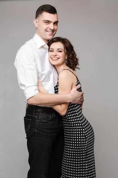 Loving couple snuggling on black background. Love concept. — Stock Photo, Image