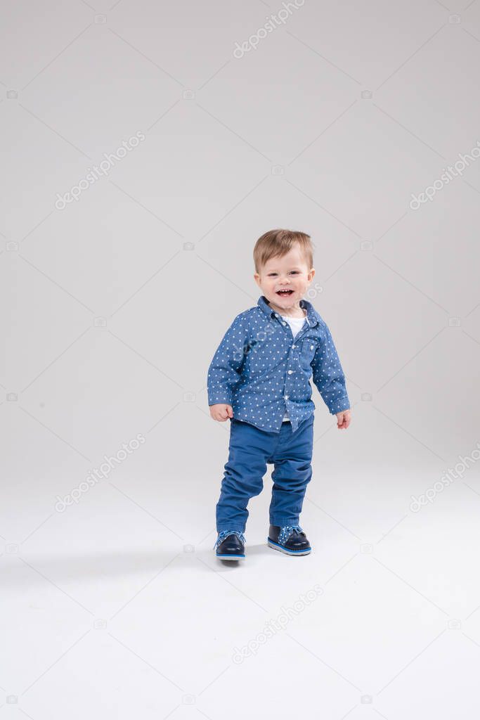 Little pretty boy walks, pictue isolated on white background
