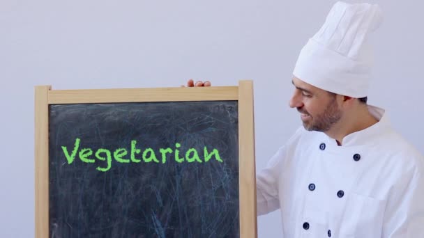 Schot Van Chef Kok Met Vegetarische Teken — Stockvideo