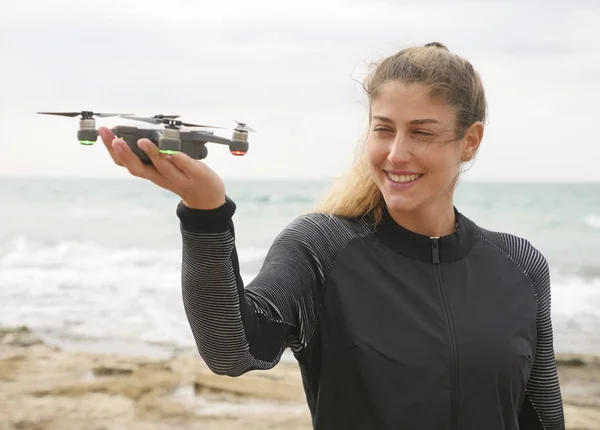Young woman holding a selfie drone — Stock Photo, Image