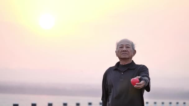 Male Senior Holding Red Heart Happy Smile Morning Sunrise Health — Stock Video