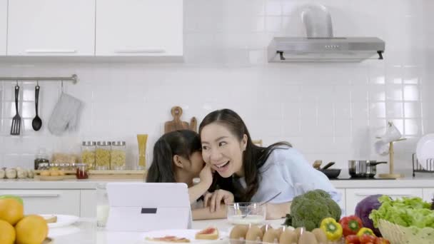 Happy Asian Family Little Girl Sharing Secrets Her Mother Kitchen — Stock Video