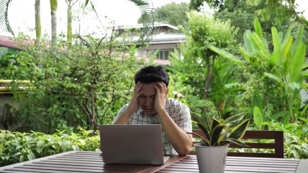 Asian Man Stressed Tired Headache While Working Computer Laptop Home — Stock Video