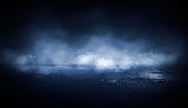 Empty street scene background with abstract spotlights light. Night view of street light reflected on water. Rays through the fog. Smoke, fog, wet asphalt with reflection of lights. 