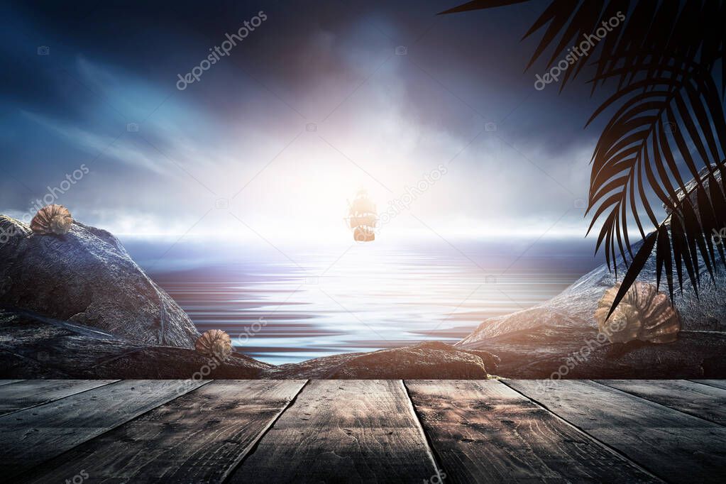 Sea evening landscape with sunset. Palm tree branches, silhouettes, sunlight. Wooden table by the sea. Night view, open-air seascape.