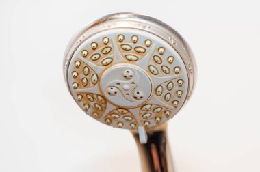 Dirty shower head with limescale and rust on it clipart