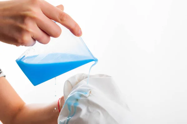 Removing stain from white shirt measuring determent by hand — Stock Photo, Image