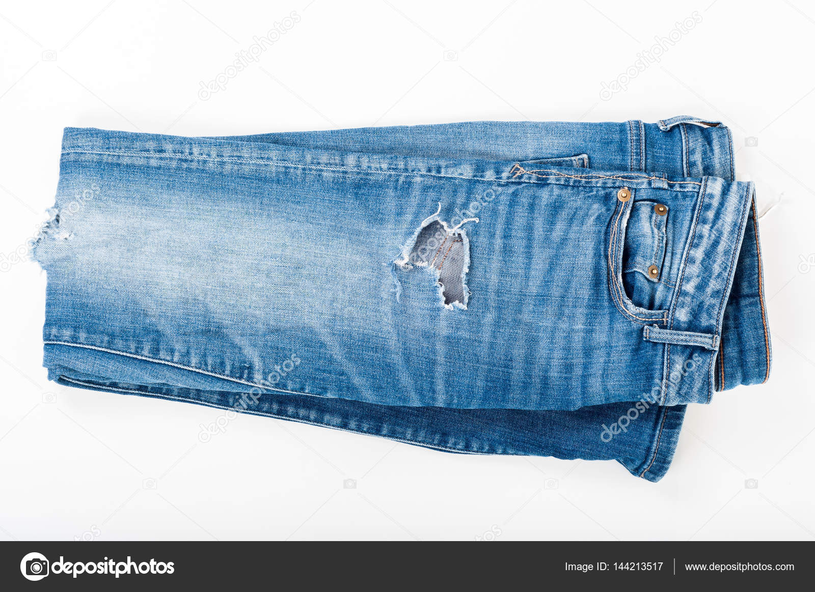 Folded ripped blue jeans on white background. Top view. Fashion Stock Photo  by ©artursfoto1 144213517