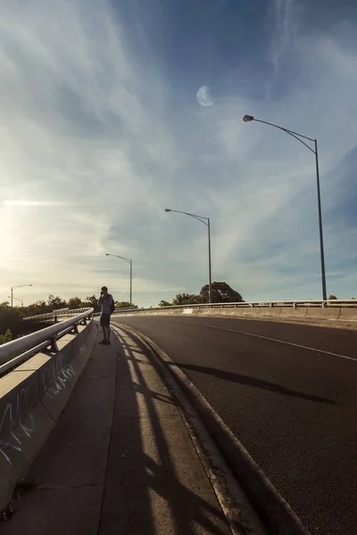 Photographer Standing On Overpass Taking Photographs Below — Stock Photo, Image