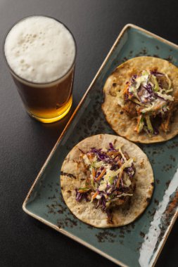 Mini Shredded Pork Tacos Served With Coleslaw and Tap Beer clipart