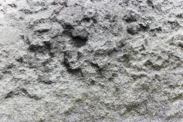 Grabado de piedra áspera en la superficie de la pared vieja —  Fotos de Stock