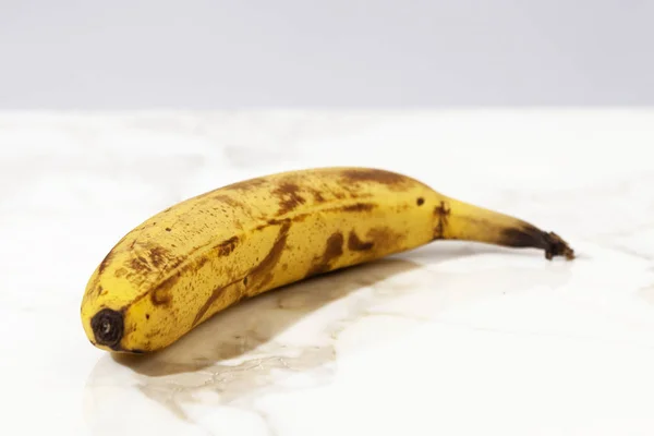 Ageing Banana On White Marble Surface — Stock Photo, Image