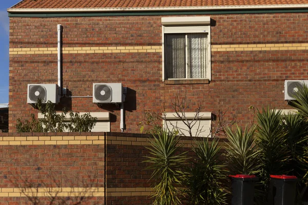 Suburban Brick House With Green Cactus Trees On Summer Afternoon — 스톡 사진