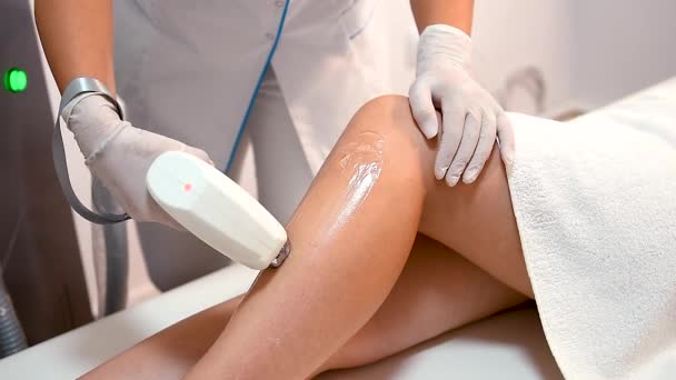 Beautician Removes Hair Beautiful Female Legs Using Laser — Stock Video