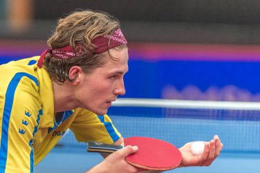 Carl Ahlander Johansson (SWE) vs Can Akkuzu (FRA) at the table t clipart